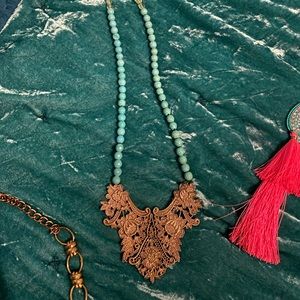 Turquoise beaded necklace with beautiful gold laced pendant